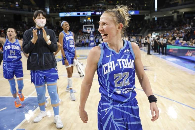 Jun 26, 2022; Chicago, Illinois, USA; Chicago Sky guard Courtney Vandersloot (22) celebrates after scoring the game winning basket against the Minnesota Lynx during the second half of a WNBA game at Wintrust Arena. Mandatory Credit: Kamil Krzaczynski-USA TODAY Sports