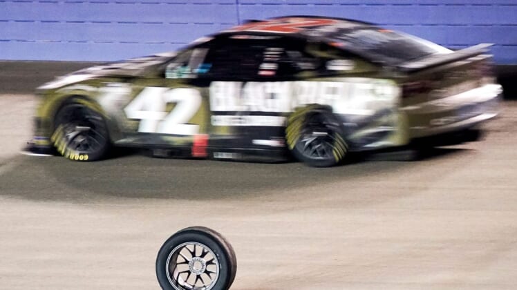 A tire that came off of NASCAR Cup Series driver Chris Buescher (17) rolls down the track during the Ally 400 at the Nashville Superspeedway in Lebanon, Tenn., Sunday, June 26, 2022.Nascar 062622 An 048