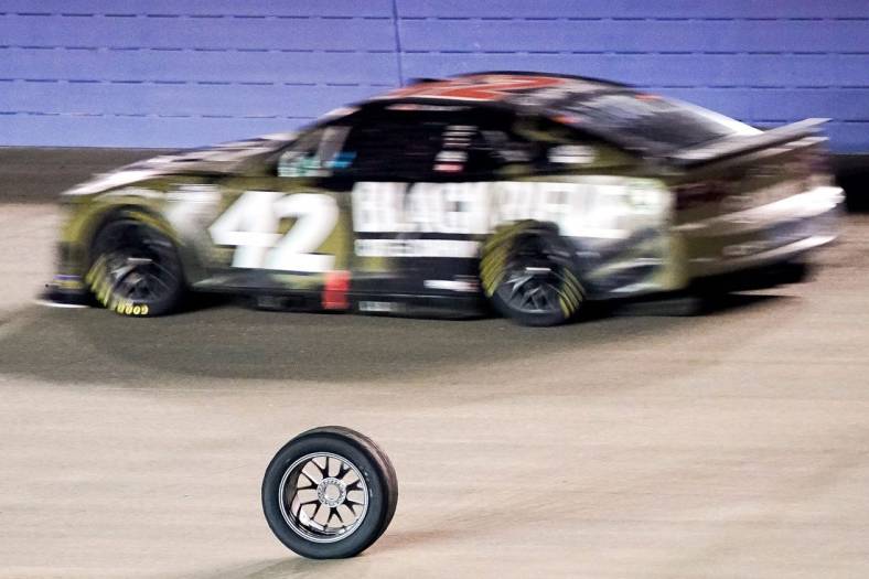 A tire that came off of NASCAR Cup Series driver Chris Buescher (17) rolls down the track during the Ally 400 at the Nashville Superspeedway in Lebanon, Tenn., Sunday, June 26, 2022.

Nascar 062622 An 048