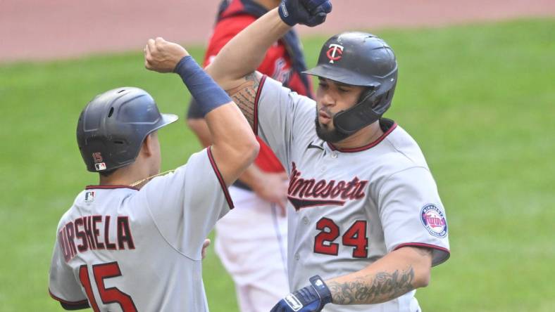 Jun 27, 2022; Cleveland, Ohio, USA; Minnesota Twins designated hitter Gary Sanchez (24) celebrates his three run home run with third baseman Gio Urshela (15) in the second inning against the Cleveland Guardians at Progressive Field. Mandatory Credit: David Richard-USA TODAY Sports