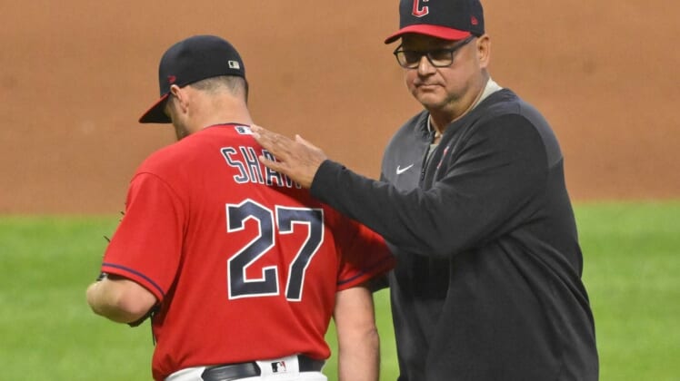 Jun 27, 2022; Cleveland, Ohio, USA; Cleveland Guardians relief pitcher Bryan Shaw (27) walks of the mound beside manager Terry Francona (77) during a pitching change in the seventh inning against the Minnesota Twins at Progressive Field. Mandatory Credit: David Richard-USA TODAY Sports