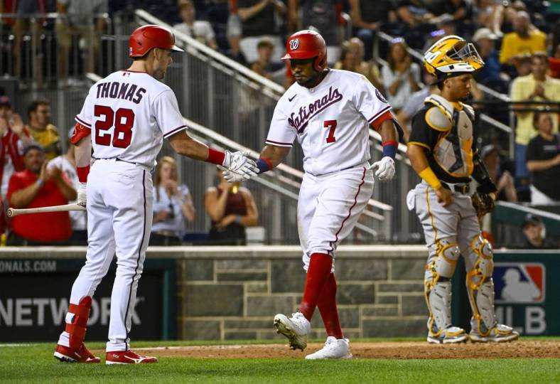 Jun 27, 2022; Washington, District of Columbia, USA; Washington Nationals third baseman Maikel Franco (7) is congratulated by left fielder Lane Thomas (28) after hitting a two run home run against the Pittsburgh Pirates during the eighth inning at Nationals Park. Mandatory Credit: Brad Mills-USA TODAY Sports