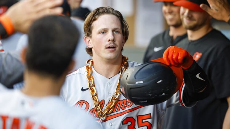 Jun 27, 2022; Seattle, Washington, USA; Baltimore Orioles catcher Adley Rutschman (35) celebrates in the dugout  after hitting a solo-home run against the Seattle Mariners during the third inning at T-Mobile Park. Mandatory Credit: Joe Nicholson-USA TODAY Sports