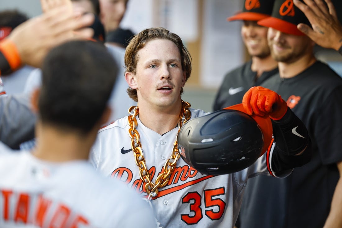 Jun 27, 2022; Seattle, Washington, USA; Baltimore Orioles catcher Adley Rutschman (35) celebrates in the dugout  after hitting a solo-home run against the Seattle Mariners during the third inning at T-Mobile Park. Mandatory Credit: Joe Nicholson-USA TODAY Sports