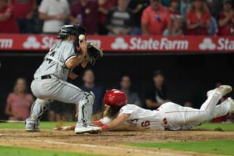 Jun 27, 2022; Anaheim, California, USA; Los Angeles Angels left fielder Brandon Marsh (16) slides into home plate to beat a throw to Chicago White Sox catcher Seby Zavala (44) in the seventh inning at Angel Stadium. Mandatory Credit: Kirby Lee-USA TODAY Sports