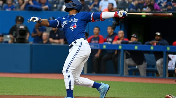 Jun 28, 2022; Toronto, Ontario, CAN;  Toronto Blue Jays right fielder Teoscar Hernandez (37) hits an RBI double against the Boston Red Sox in the first inning at Rogers Centre. Mandatory Credit: Dan Hamilton-USA TODAY Sports