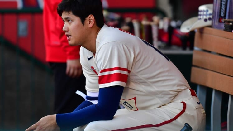 June 28, 2022; Anaheim, California, USA; Los Angeles Angels designated hitter Shohei Ohtani (17) watches game action against the Chicago White Sox during the first inning at Angel Stadium. Mandatory Credit: Gary A. Vasquez-USA TODAY Sports