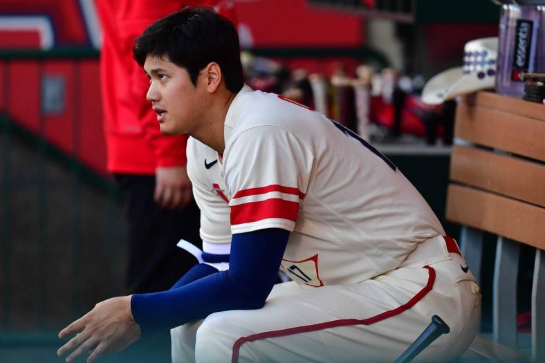 June 28, 2022; Anaheim, California, USA; Los Angeles Angels designated hitter Shohei Ohtani (17) watches game action against the Chicago White Sox during the first inning at Angel Stadium. Mandatory Credit: Gary A. Vasquez-USA TODAY Sports