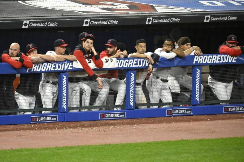 Jun 28, 2022; Cleveland, Ohio, USA; The Cleveland Guardians stand in the dugout in the ninth inning of a loss to the Minnesota Twins at Progressive Field. Mandatory Credit: David Richard-USA TODAY Sports