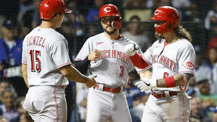 Jun 28, 2022; Chicago, Illinois, USA; Cincinnati Reds second baseman Jonathan India (6) celebrates with right fielder Albert Almora Jr. (3) and center fielder Nick Senzel (15) after hitting a three-run home run against the Chicago Cubs during the seventh inning at Wrigley Field. Mandatory Credit: Kamil Krzaczynski-USA TODAY Sports