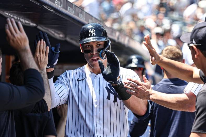 Jun 29, 2022; Bronx, New York, USA; New York Yankees center fielder Aaron Judge (99) celebrates his two-run home run during the first inning against the Oakland Athletics at Yankee Stadium. Mandatory Credit: Vincent Carchietta-USA TODAY Sports