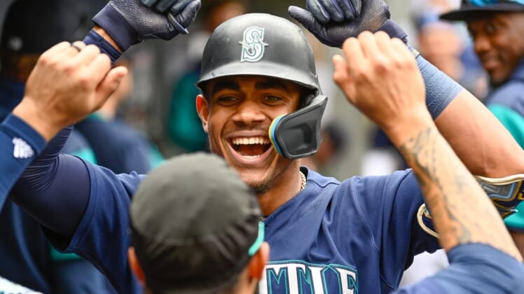 Jun 29, 2022; Seattle, Washington, USA; Seattle Mariners center fielder Julio Rodriguez (44) celebrates in the dugout after hitting a 2-run home run against the Baltimore Orioles during the fourth inning at T-Mobile Park. Mandatory Credit: Steven Bisig-USA TODAY Sports