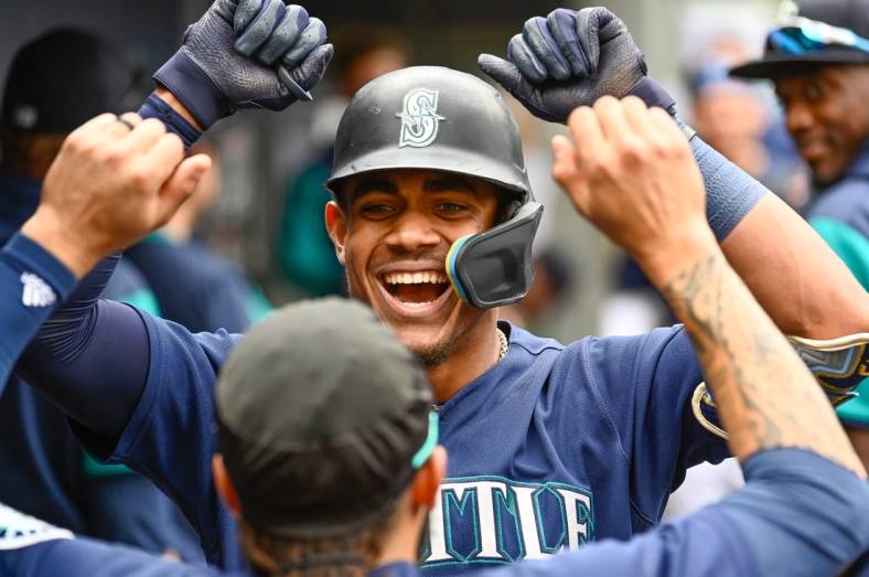 Jun 29, 2022; Seattle, Washington, USA; Seattle Mariners center fielder Julio Rodriguez (44) celebrates in the dugout after hitting a 2-run home run against the Baltimore Orioles during the fourth inning at T-Mobile Park. Mandatory Credit: Steven Bisig-USA TODAY Sports