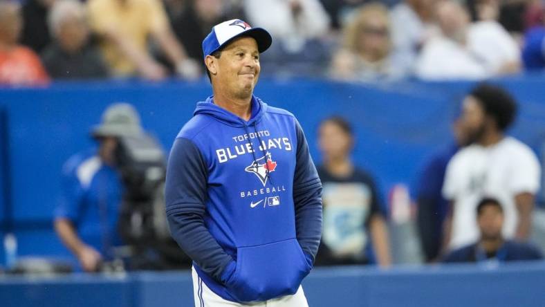 Jun 29, 2022; Toronto, Ontario, CAN; Toronto Blue Jays manager Charlie Montoyo (25) reacts to a call during the second inning against the Boston Red Sox at Rogers Centre. Mandatory Credit: Kevin Sousa-USA TODAY Sports