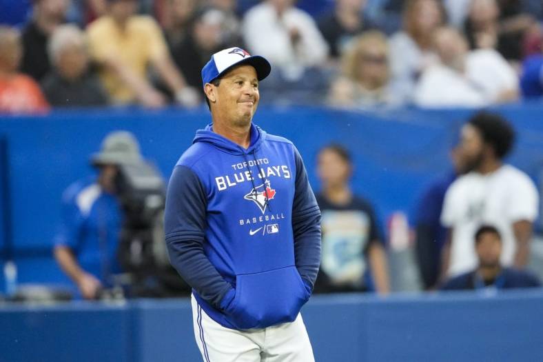 Jun 29, 2022; Toronto, Ontario, CAN; Toronto Blue Jays manager Charlie Montoyo (25) reacts to a call during the second inning against the Boston Red Sox at Rogers Centre. Mandatory Credit: Kevin Sousa-USA TODAY Sports