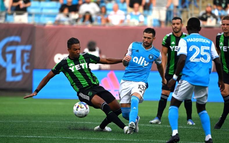 Jun 30, 2022; Charlotte, North Carolina, USA; Austin FC forward Danny Hoesen (9) and Charlotte FC midfielder Brandt Bronico (13) fight for the ball in the first half at Bank of America Stadium. Mandatory Credit: Bob Donnan-USA TODAY Sports