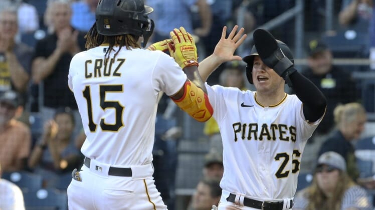 Jun 30, 2022; Pittsburgh, Pennsylvania, USA; Pittsburgh Pirates first baseman Josh VanMeter (right) congratulates shortstop Oneil Cruz (15) on his two-run home run against the Milwaukee Brewers during the second inning at PNC Park. Mandatory Credit: Charles LeClaire-USA TODAY Sports