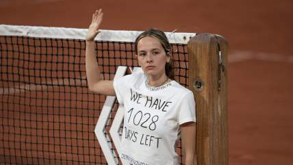 WATCH: Protestor at French Open ties herself to net during a semifinal match