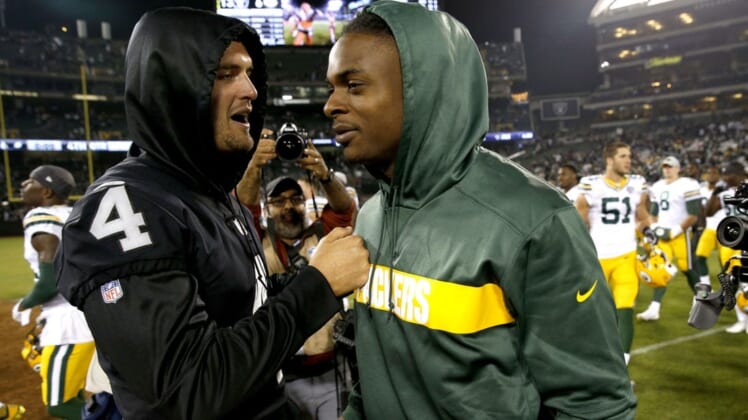 Raiders quarterback Derek Carr (4) and former Green Bay Packers wide receiver Davante Adams (17), pictured after the game at Oakland Coliseum. Mandatory Credit: Cary Edmondson-USA TODAY Sports