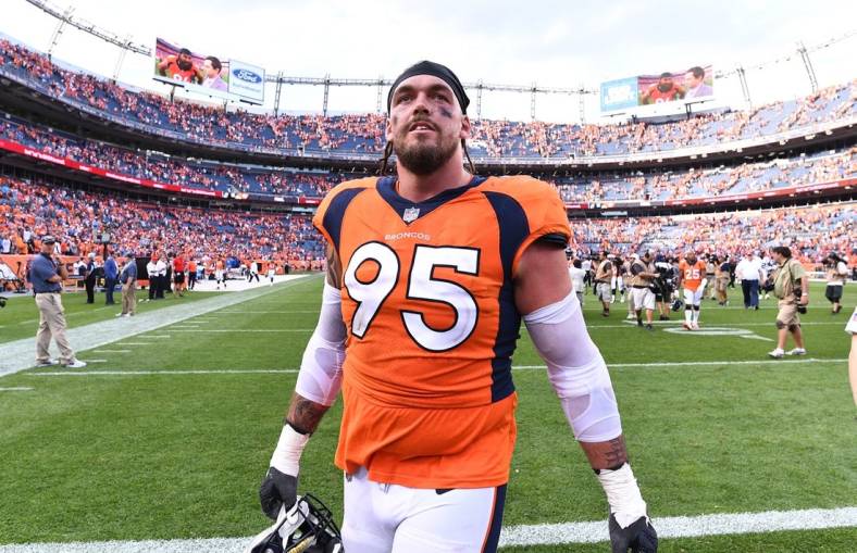 Sep 16, 2018; Denver, CO, USA; Denver Broncos defensive end Derek Wolfe (95) celebrates the win over the Oakland Raiders at Broncos Stadium at Mile High. Mandatory Credit: Ron Chenoy-USA TODAY Sports