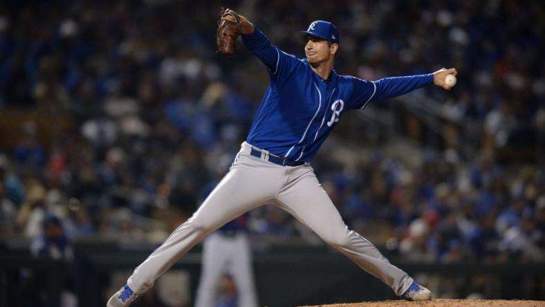 Mar 8, 2019; Phoenix, AZ, USA; Kansas City Royals relief pitcher Foster Griffin (60) works against a Los Angeles Dodgers batter during the fifth inning at Camelback Ranch. Mandatory Credit: Orlando Ramirez-USA TODAY Sports