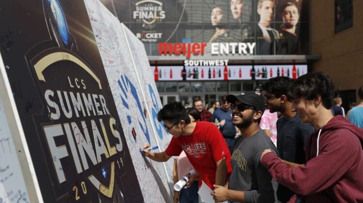 Aug 25, 2019; Detroit, MI, USA; Fans sign the large signing board outside the southwest entrance before the LCS Summer Finals event between Team Liquid and Team Cloud9 at Little Caesars Arena. Mandatory Credit: Raj Mehta-USA TODAY Sports