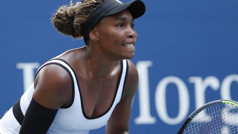 Aug 26, 2019; Flushing, NY, USA; Venus Williams of the United States prepares to return serve against Saisai Zheng of China (not pictured) in the first round on day one of the 2019 U.S. Open tennis tournament at USTA Billie Jean King National Tennis Center. Mandatory Credit: Geoff Burke-USA TODAY Sports