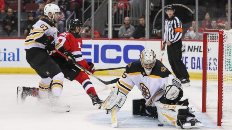 Sep 16, 2019; Newark, NJ, USA; Boston Bruins goaltender Kyle Keyser (85) makes a save on New Jersey Devils center Travis Zajac (19) during the second period at Prudential Center. Mandatory Credit: Ed Mulholland-USA TODAY Sports