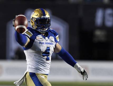 Nov 24, 2019; Calgary, Alberta, CAN; Winnipeg Blue Bombers linebacker Adam Bighill (4) celebrates after recovering a fumble against the Winnipeg Blue Bombers in the first half during the 107th Grey Cup championship football game at McMahon Stadium. Mandatory Credit: Eric Bolte-USA TODAY Sports