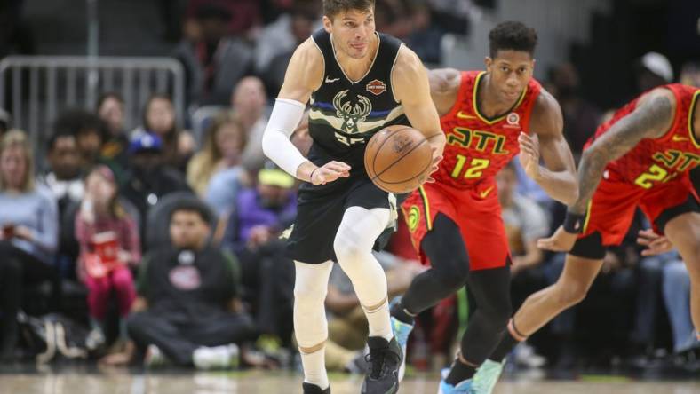 Dec 27, 2019; Atlanta, Georgia, USA; Milwaukee Bucks guard Kyle Korver (26) dribbles the ball against the Atlanta Hawks in the second half at State Farm Arena. Mandatory Credit: Brett Davis-USA TODAY Sports