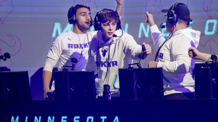 Jan 26, 2020; Minneapolis, Minnesota, USA; Obaid Asim and Alex Alexx Carpenter and Adam Assault Garcia of the Minnesota Rokkr celebrate after defeating the Toronto Ultra in a round during the Call of Duty League Launch Weekend at The Armory. Mandatory Credit: Bruce Kluckhohn-USA TODAY Sports