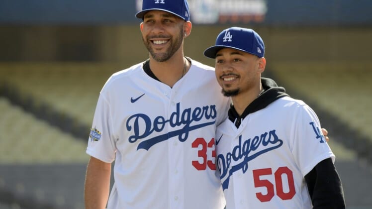 Feb 12, 2020; Los Angeles, California, USA;  Los Angeles Dodgers players David Price (33) and Mookie Betts (50) pose during a press conference at Dodger Stadium. Mandatory Credit: Kirby Lee-USA TODAY Sports