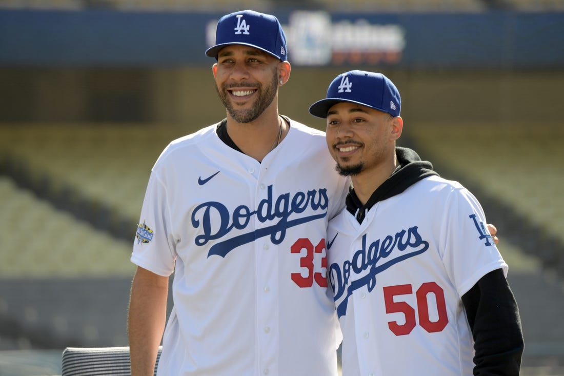 Feb 12, 2020; Los Angeles, California, USA;  Los Angeles Dodgers players David Price (33) and Mookie Betts (50) pose during a press conference at Dodger Stadium. Mandatory Credit: Kirby Lee-USA TODAY Sports