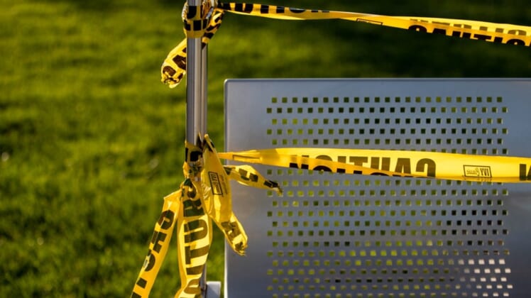 May 8, 2020; Cincinnati, OH, USA; A view of caution tape wrapped around a swing in Smale Riverfront Park in Cincinnati. Areas of the park are blocked off due to concerns of COVID-19. Mandatory Credit: Aaron Doster-USA TODAY NETWORK