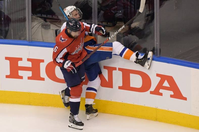 Aug 12, 2020; Toronto, Ontario, CAN; Washington Capitals defenseman Michal Kempny (6) checks New York Islanders right wing Leo Komarov (47) in the first period in game one of the first round of the 2020 Stanley Cup Playoffs at Scotiabank Arena. Mandatory Credit: Dan Hamilton-USA TODAY Sports