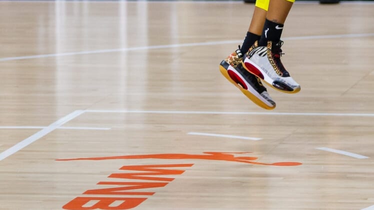 Oct 2, 2020; Bradenton, Florida, USA; The shoes of Seattle Storm guard Jordin Canada (21) with the WNBA logo during game 1 of the WNBA finals against the Las Vegas Aces at IMG Academy. Mandatory Credit: Mary Holt-USA TODAY Sports
