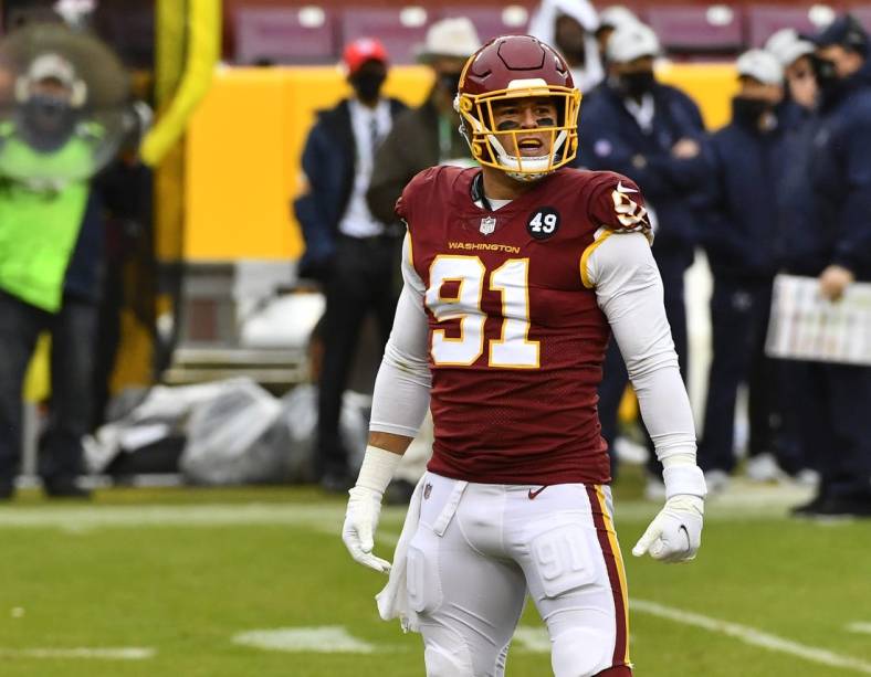 Oct 25, 2020; Landover, Maryland, USA; Washington Football Team defensive end Ryan Kerrigan (91) reacts after recording a sack against the Dallas Cowboys during the second half at FedExField. Mandatory Credit: Brad Mills-USA TODAY Sports