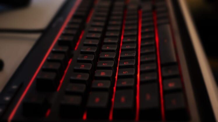 A custom gaming keyboard backlit with red LED lights waits for tactile input before Manual took on Boone County in a Rocket League match, which was streamed on YouTube on Thursday, March 5, 2020.