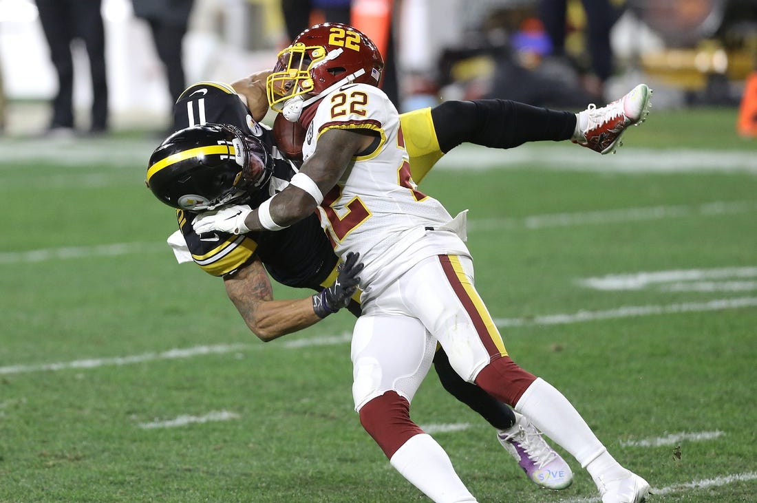 Dec 7, 2020; Pittsburgh, Pennsylvania, USA;  Pittsburgh Steelers wide receiver Chase Claypool (11) catches a pass against Washington Football Team free safety Deshazor Everett (22) during the second quarter at Heinz Field. Mandatory Credit: Charles LeClaire-USA TODAY Sports
