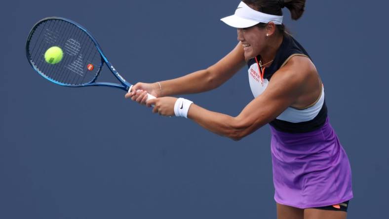 Mar 24, 2021; Miami, Florida, USA; Xiyu Wang of China hits a backhand against Jelena Ostapenko of Latvia (not pictured) in the first round of the Miami Open at Hard Rock Stadium. Mandatory Credit: Geoff Burke-USA TODAY Sports