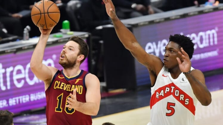 Apr 10, 2021; Cleveland, Ohio, USA; Cleveland Cavaliers guard Matthew Dellavedova (18) shoots the ball against Toronto Raptors forward Stanley Johnson (5) during the first quarter at Rocket Mortgage FieldHouse. Mandatory Credit: Ken Blaze-USA TODAY Sports