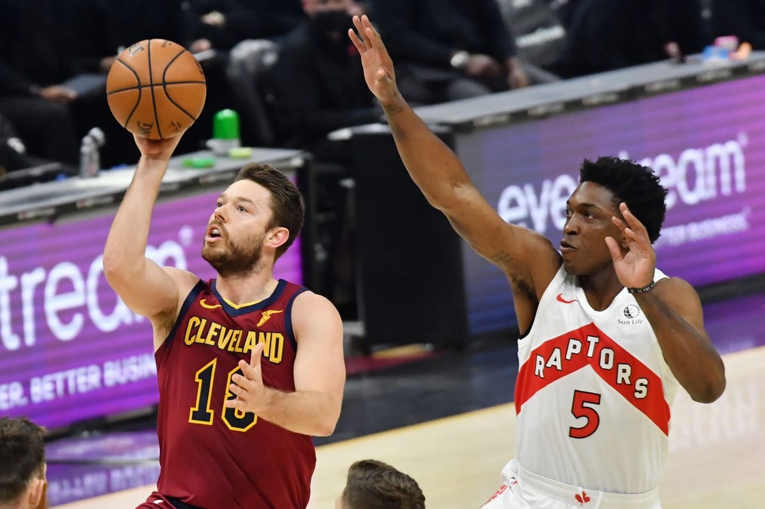 Apr 10, 2021; Cleveland, Ohio, USA; Cleveland Cavaliers guard Matthew Dellavedova (18) shoots the ball against Toronto Raptors forward Stanley Johnson (5) during the first quarter at Rocket Mortgage FieldHouse. Mandatory Credit: Ken Blaze-USA TODAY Sports