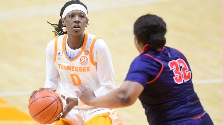 Tennessee guard/forward Rennia Davis (0) looks at the basket while defended by Ole Miss forward Iyanla Kitchens (32) during a basketball game between the Tennessee Lady Vols and the Ole Miss Rebels at Thompson-Boling Arena in Knoxville, Tenn., on Thursday, January 28, 2021.Syndication The Knoxville News Sentinel