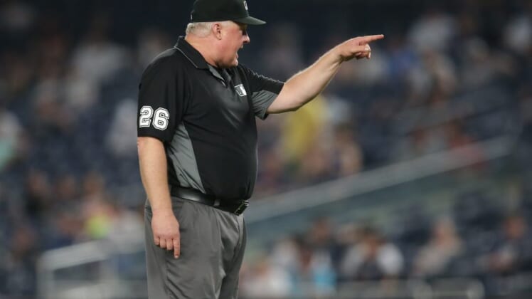 Jun 6, 2021; Bronx, New York, USA; second base umpire Bill Miller (26) ejects New York Yankees bench coach Carlos Mendoza (not pictured) during the tenth inning at Yankee Stadium. Mandatory Credit: Brad Penner-USA TODAY Sports