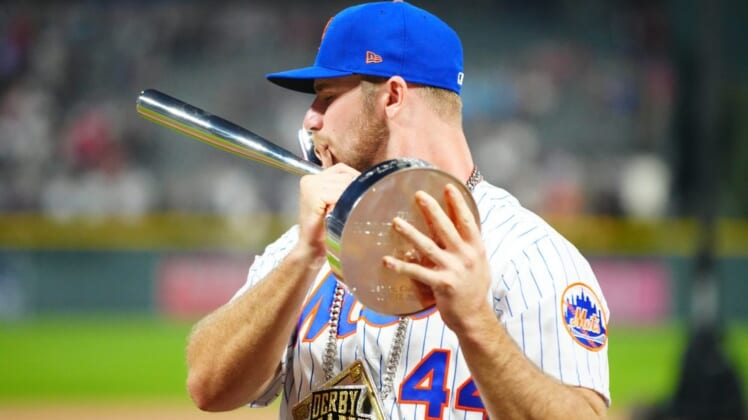 Jul 12, 2021; Denver, CO, USA; New York Mets first baseman Pete Alonso poses for photographs with the winners trophy following his victory in the 2021 MLB Home Run Derby. Mandatory Credit: Mark J. Rebilas-USA TODAY Sports