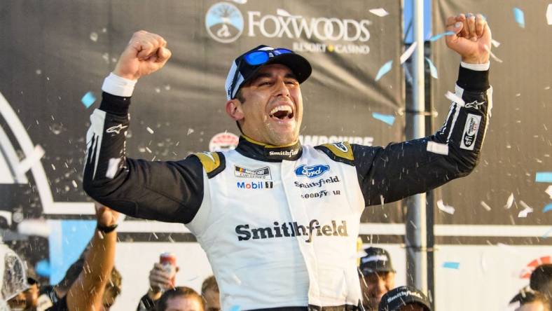 Jul 18, 2021; Loudon, New Hampshire, USA; NASCAR Cup Series driver Aric Almirola (10) celebrates after winning the Foxwoods Resort Casino 301 at the New Hampshire Motor Speedway. Mandatory Credit: Brian Fluharty-USA TODAY Sports