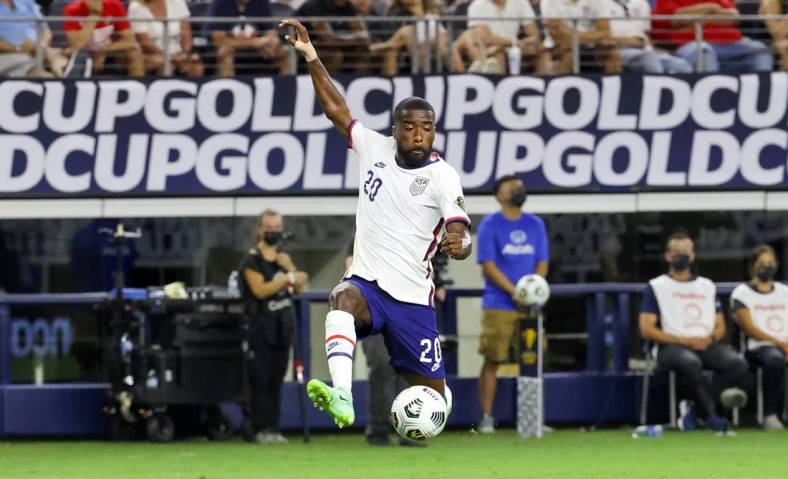 Jul 25, 2021; Arlington, Texas, USA; United States defender Shaquell Moore (20) tries to controls the ball during the first half against Jamaica in a CONCACAF Gold Cup quarterfinal soccer match at AT&T Stadium. Mandatory Credit: Kevin Jairaj-USA TODAY Sports