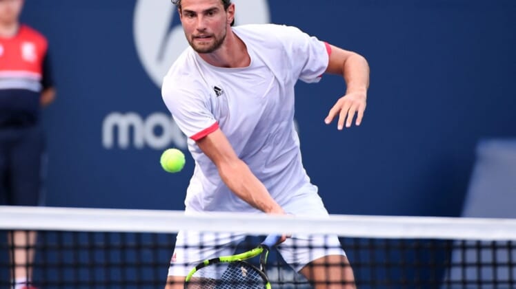 Aug 7, 2021; Toronto, Ontario, Canada; Maxime Cressy of the United States plays a shot against Feliciano Lopez of Spain in first round qualifying play for the National Bank Open at the Aviva Centre. Mandatory Credit: Dan Hamilton-USA TODAY Sports