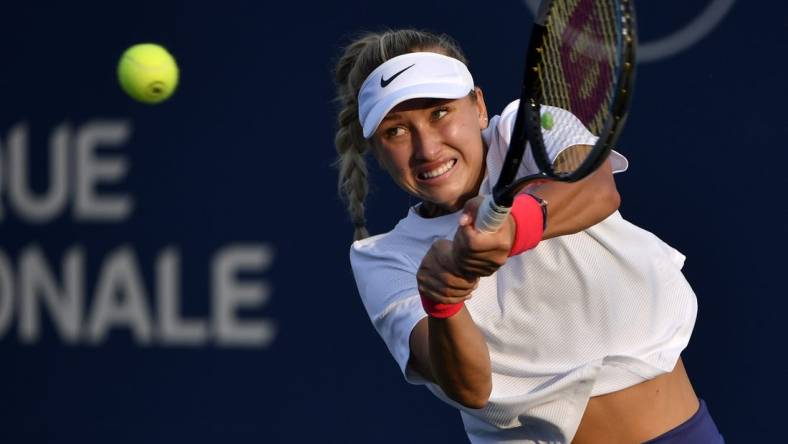 Aug 9, 2021; Montreal, Quebec, Canada; Anastasia Potapova of Russia hits a shot against Shelby Rogers of the United States (not pictured) during first round play at Stade IGA. Mandatory Credit: Eric Bolte-USA TODAY Sports