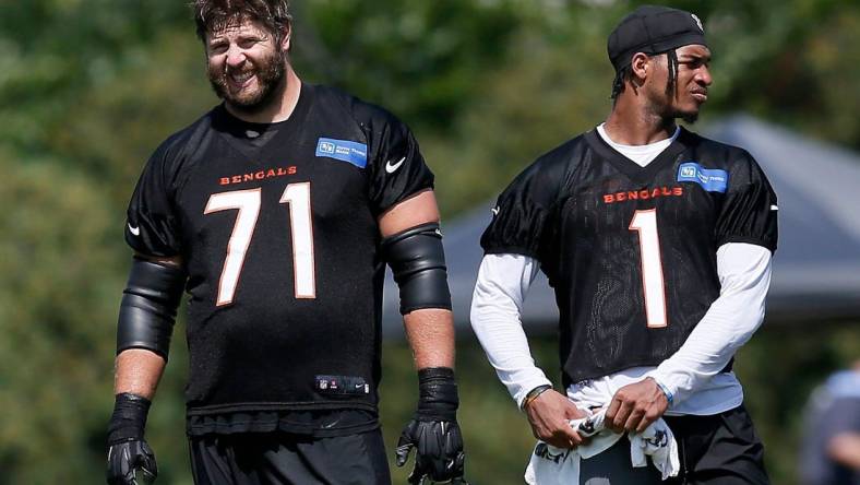 Cincinnati Bengals offensive tackle Riley Reiff (71) watches from the sideline between sessions during a training camp practice at the Paul Brown Stadium practice facility in downtown Cincinnati on Thursday, Aug. 12, 2021. Air temperatures reached the upper 90s Thursday, with "real feel" rising above 110 in the afternoon.

Cincinnati Bengals Training Camp